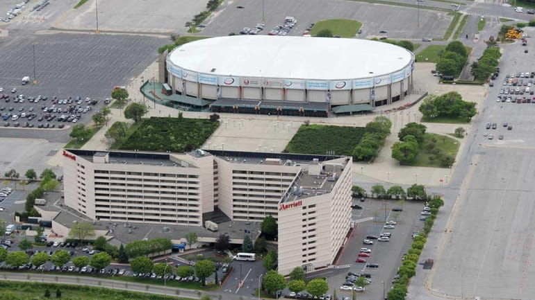 An aerial view of the Nassau Coliseum. In the foreground...