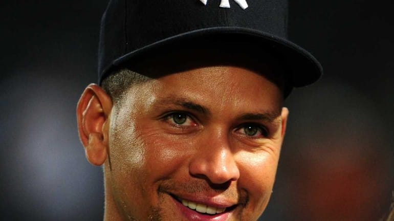 Alex Rodriguez of the New York Yankees is interviewed after...