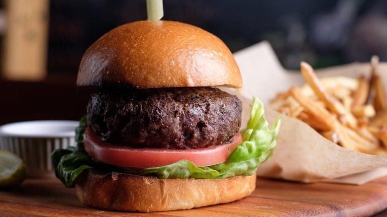 The Market Bistro Burger is a blend of dry aged...