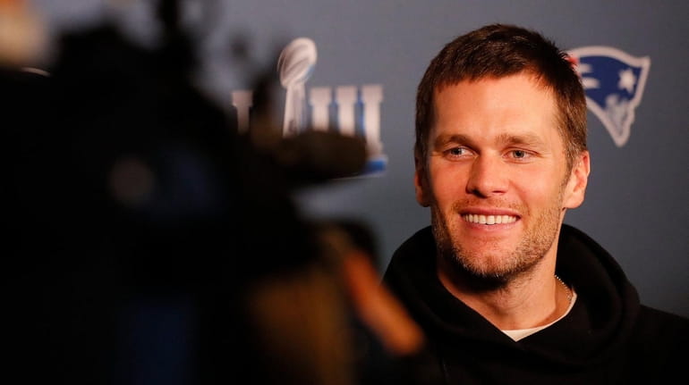 Tom Brady of the Patriots speaks to the media during...