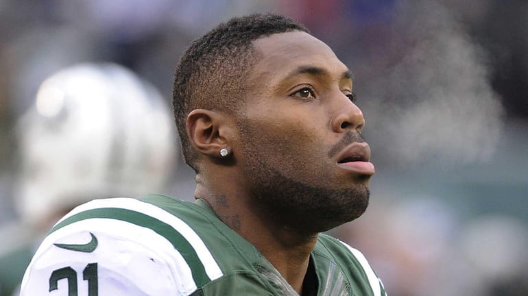Steam comes out of the mouth of Antonio Cromartie as...