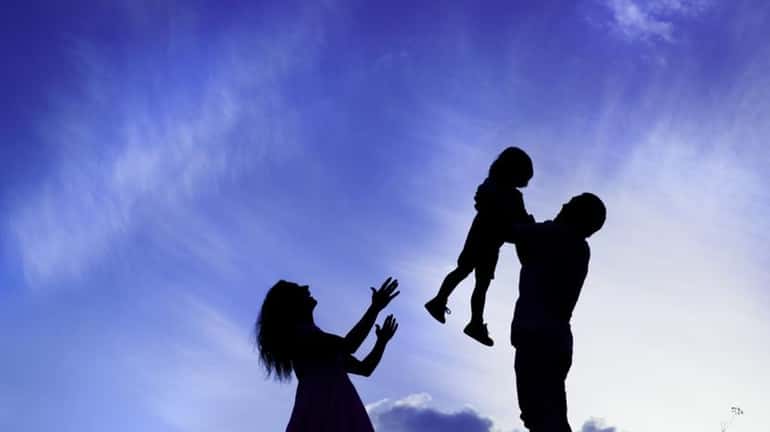 Silhouettes of parents with their children.