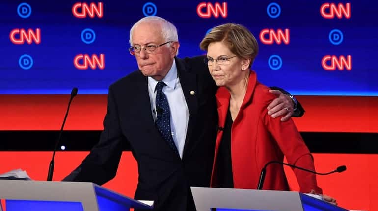 Sens. Bernie Sanders and Elizabeth Warren hug at the end...