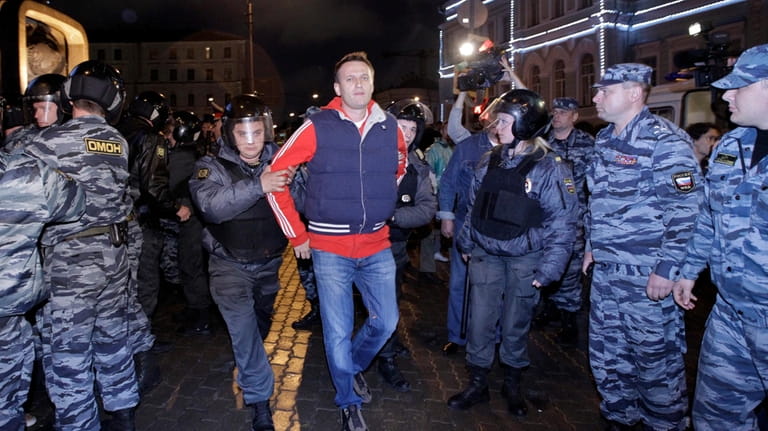 Police detain Alexei Navalny, a prominent anti-corruption whistle blower and...
