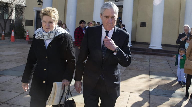Special counsel Robert Mueller walks with his wife Ann Mueller on...