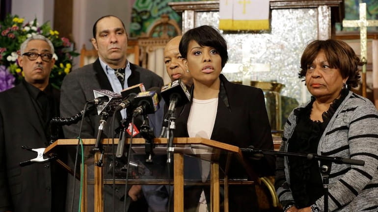 Baltimore Mayor Stephanie Rawlings-Blake speaks in front of faith and...