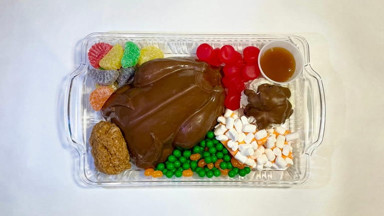 A turkey dinner  featuring a chocolate turkey and candy...