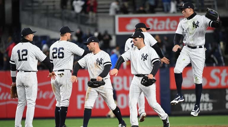 New York Yankees players celebrate their 3-1 win against the...