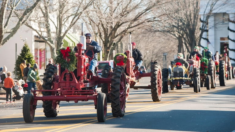 Tractors are driven in the annual Santa Parade on Newtown...