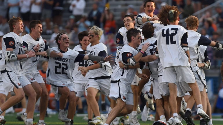 Manhasset teammates celebrate their 13-5 win over Westhill in the...