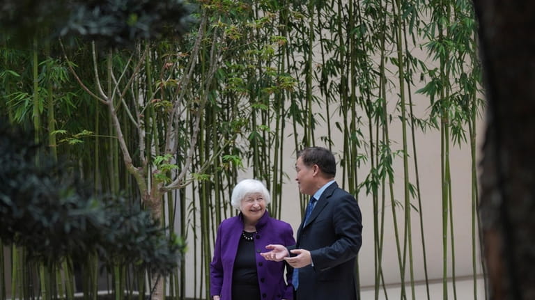 U.S. Treasury Secretary Janet Yellen, left talks with Governor of...