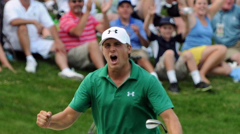 PGA Tour pro Jordan Spieth reacts to chipping in from...