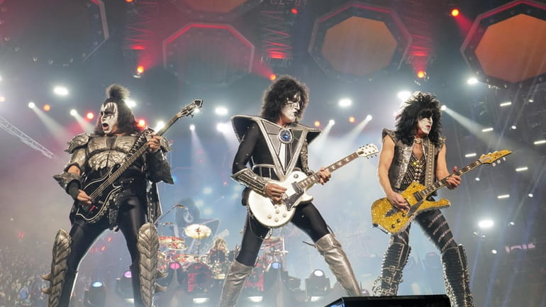 Gene Simmons, from left, Tommy Thayer, and Paul Stanley of...