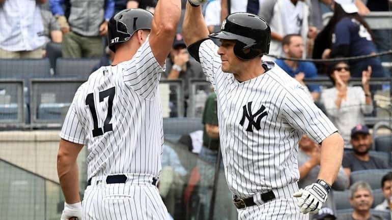 Chase Headley is congratulated at home by Matt Holiday after...