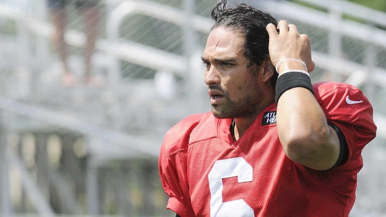 Jets quarterback Mark Sanchez watches during training camp in Cortland....