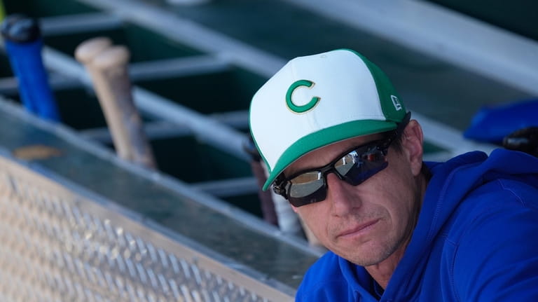 Chicago Cubs manager Craig Counsell pauses in the dugout prior...