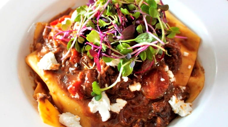 Open-faced short rib ravioli with caramelized onions and goat cheese...