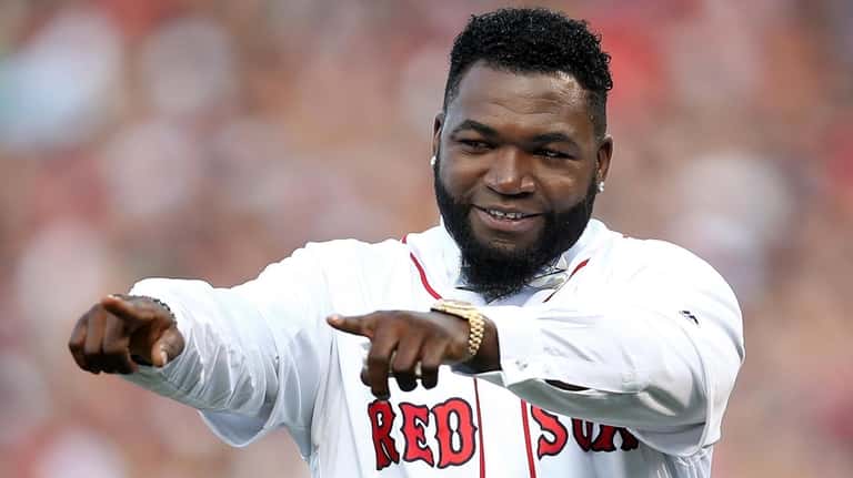 Former Red Sox player David Ortiz reacts during his jersey retirement...
