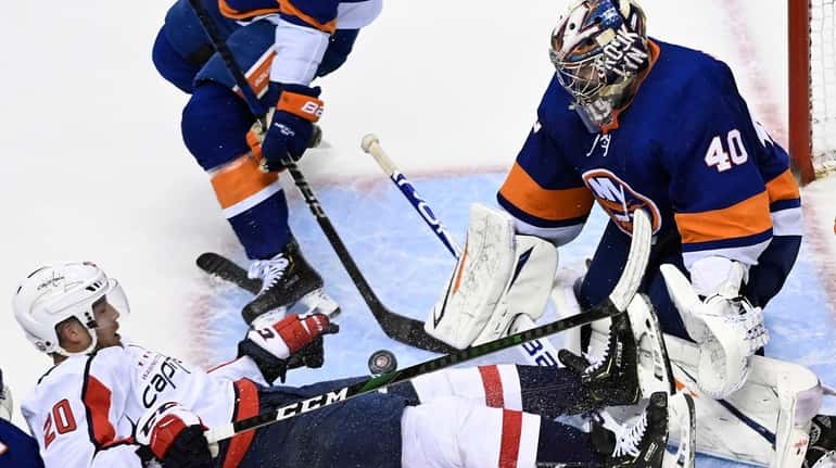 Islanders goalie Semyon Varlamov has his hands full in third...