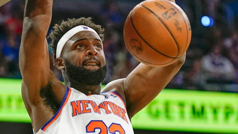 The Knicks' Mitchell Robinson dunks the ball against the Orlando...