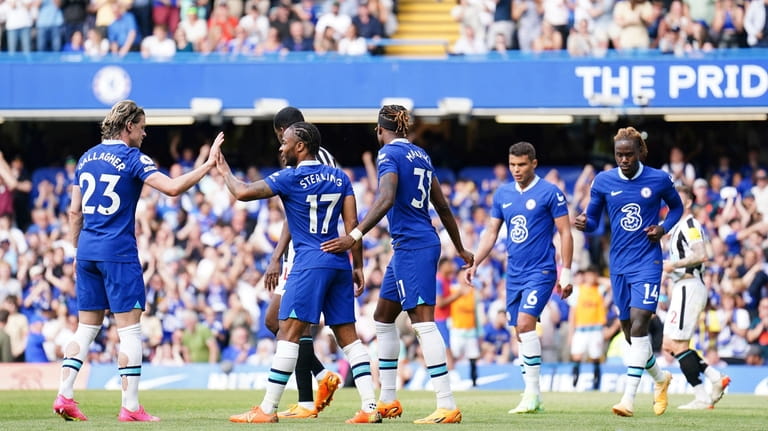Chelsea celebrate an own goal by Newcastle United's Kieran Trippier,...