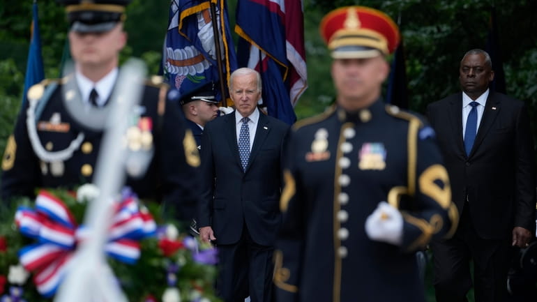 President Joe Biden and Defense Secretary Lloyd Austin arrive at...