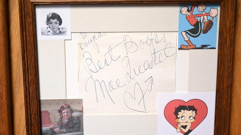 An original Mae Questel autograph is framed with images depicting...