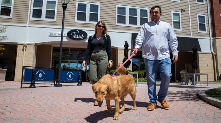 Domenic Colavito and Amanda Singer with their dog Holly in Patchogue....