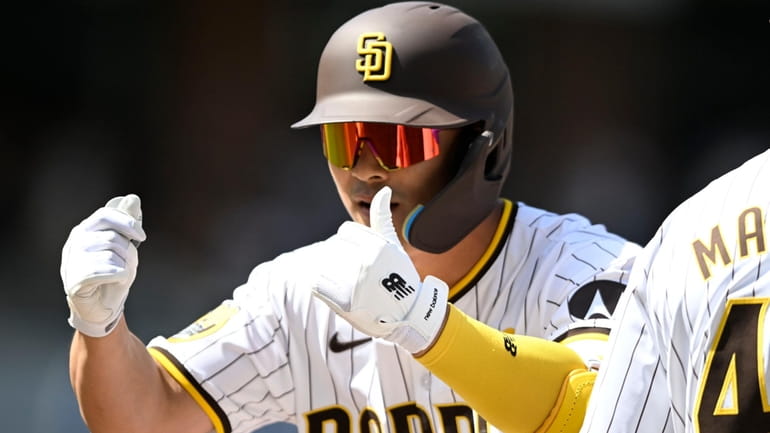 San Diego Padres shortstop Ha-Seong Kim (7) gestures after hitting...