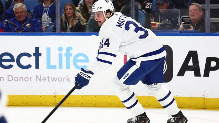 Toronto Maple Leafs center Auston Matthews (34) carries the puck...