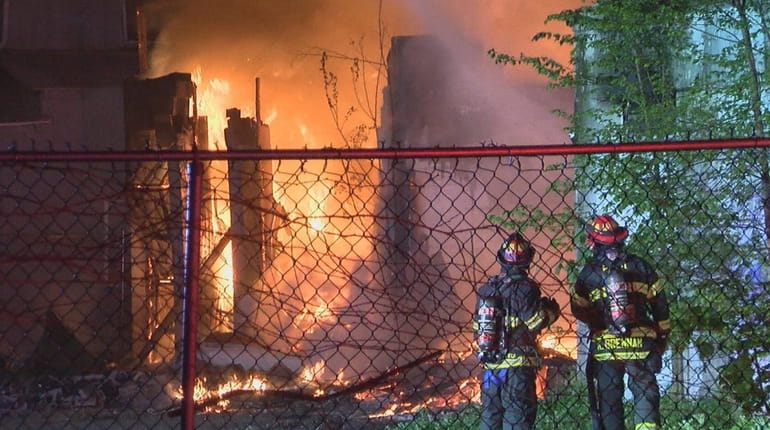 Fire officials said three commercial garage bays were destroyed in...