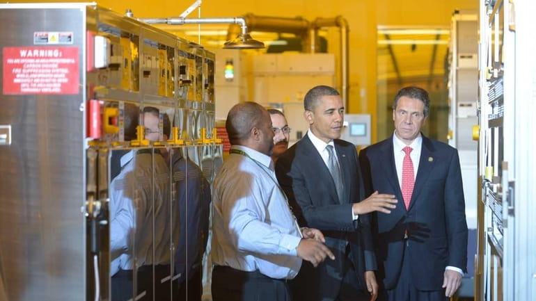 President Barack Obama tours the College of Nanoscale Science and...