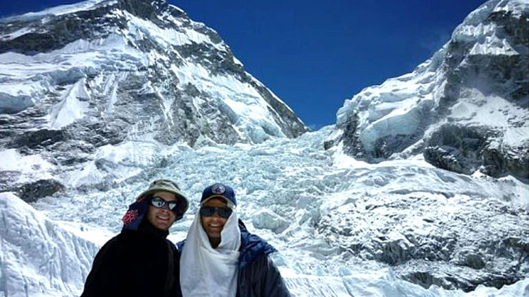 Richard Birrer and his son stand at the Everest ice...