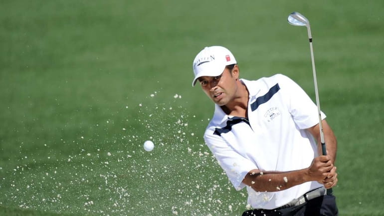 Arjun Atwal of India hits from a bunker on the...