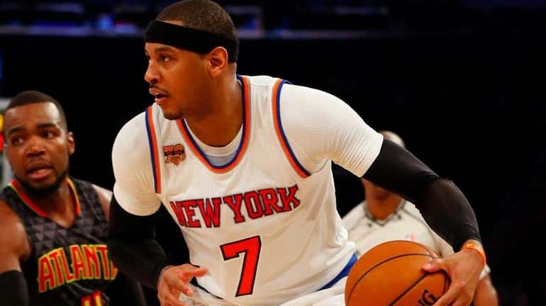 Carmelo Anthony of the New York Knicks controls the ball...
