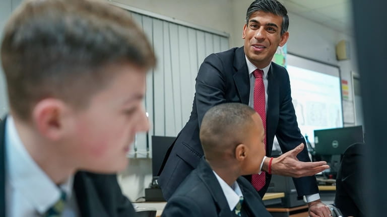 Britain's Prime Minister Rishi Sunak meets students taking part in...