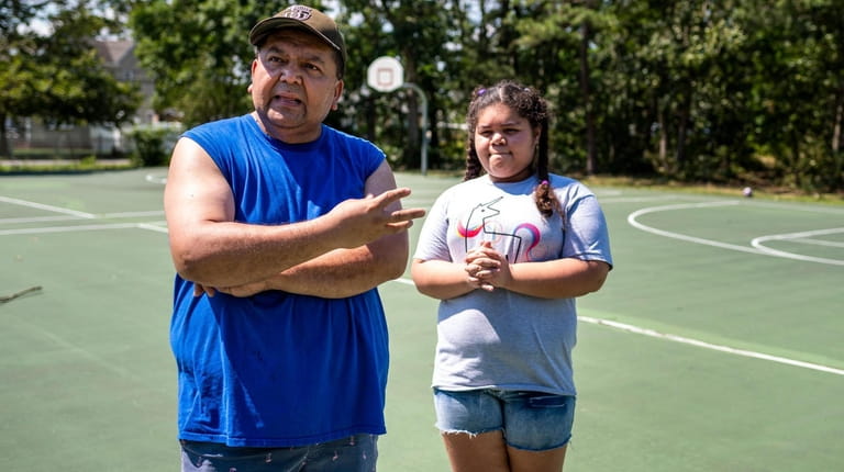 Brentwood resident Ramon Reina visiting Roberto Clemente Park with his daughter, Elizabeth,...