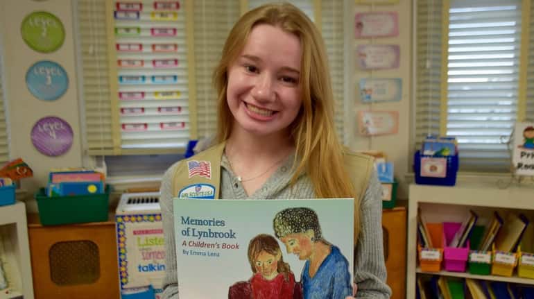 Emma Lenz, a junior at Lynbrook High School, holds "Memories of...