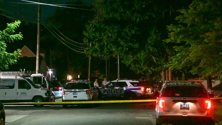 Suffolk County police investigate a fatal shooting on Holbrook Street in...