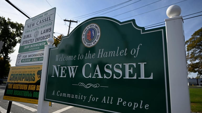 A sign welcomes visitors to New Cassel.