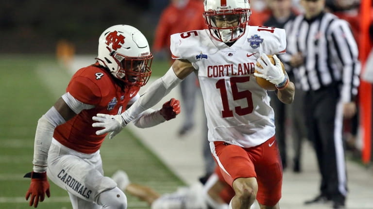 Cortland's Cole Burgess (15) runs for a touchdown past North...