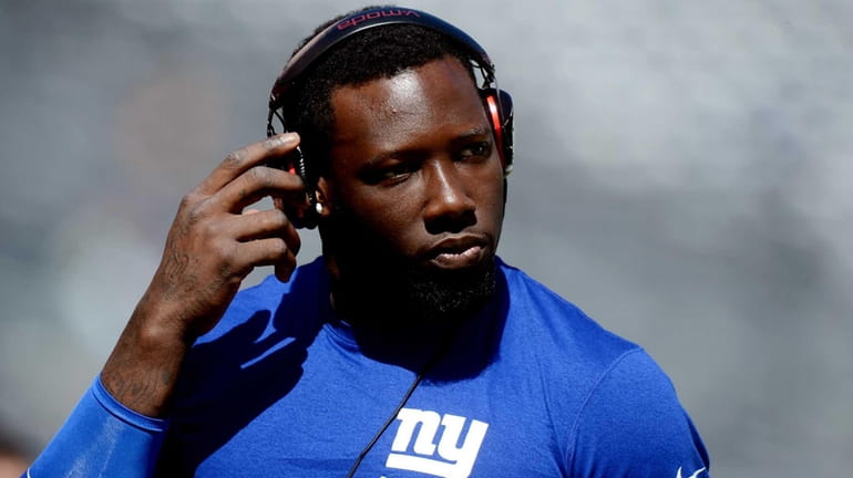 Defensive end Jason Pierre-Paul of the Giants warms up before...