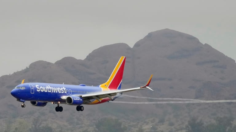 A Southwest Airlines jet arrives at Sky Harbor International Airport,...