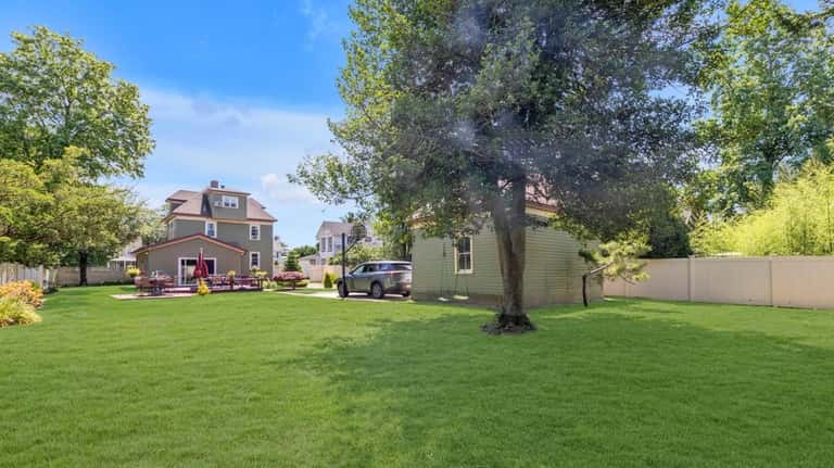 The expansive yard, with detached two-car garage.