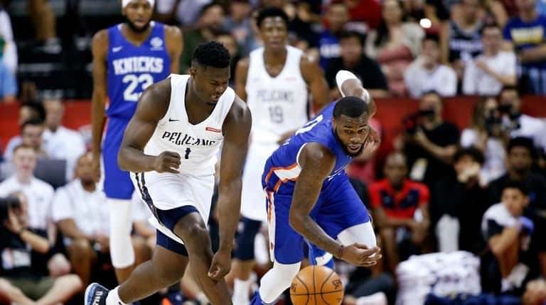 Zion Williamson, left, and the Knicks' Kadeem Allen chase after...