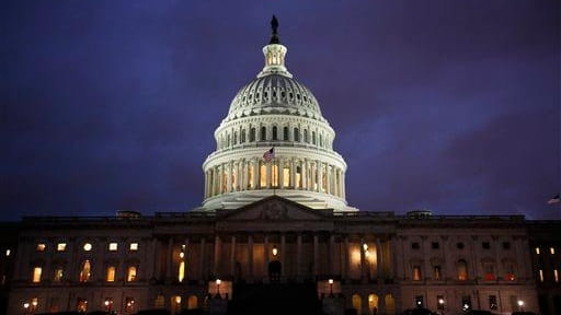 The U.S. Capitol is seen at dusk in Washington on...