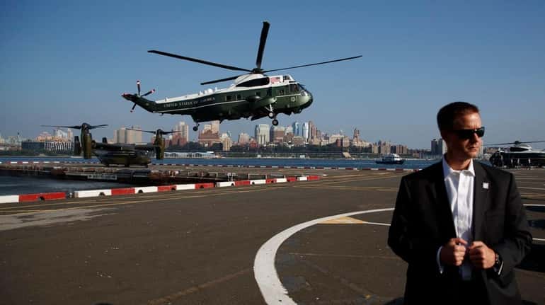 Marine One, carrying President Donald Trump, lands at the Downtown...