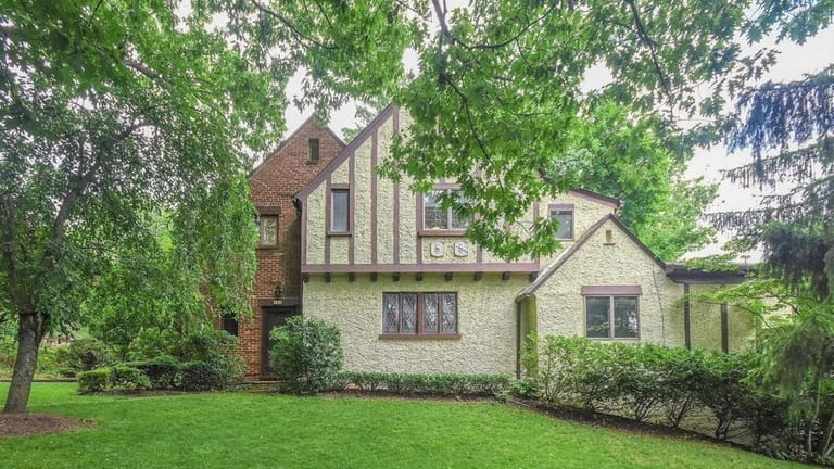 Priced at $1.49 million, this Tudor on Luquer Road features...