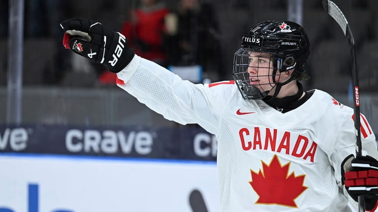 Canada's Macklin Celebrini celebrates scoring during the IIHF World Junior...