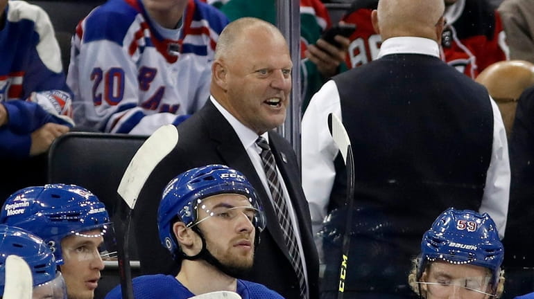 Gerard Gallant of the Rangers looks on during the first period...